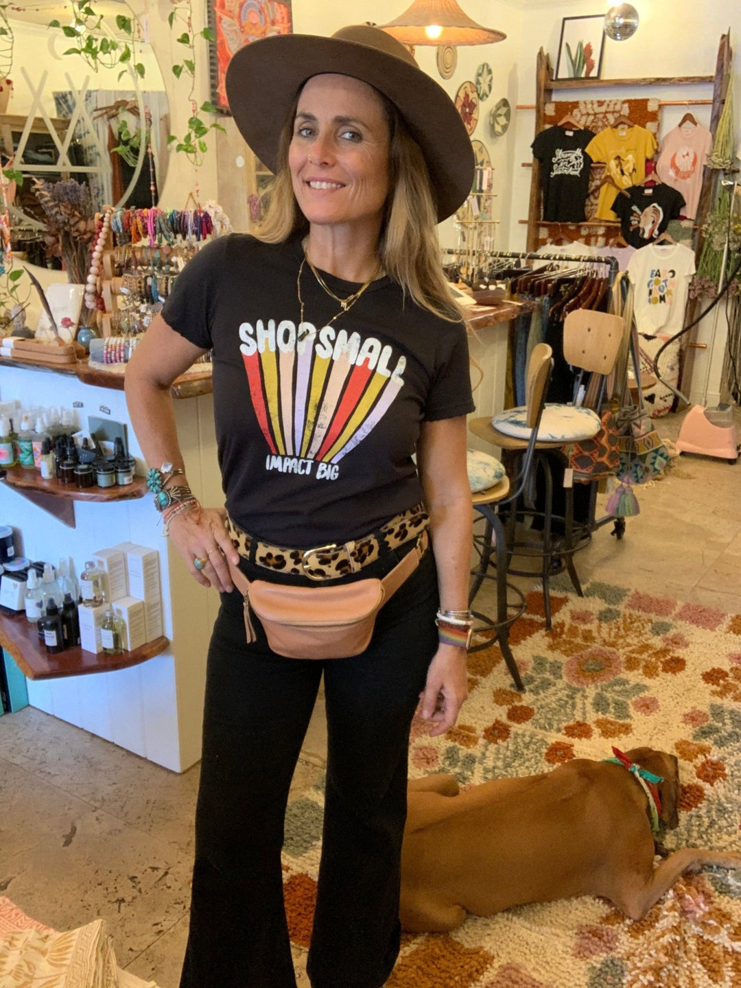 Meadow wearing shop small tee in boutique.
