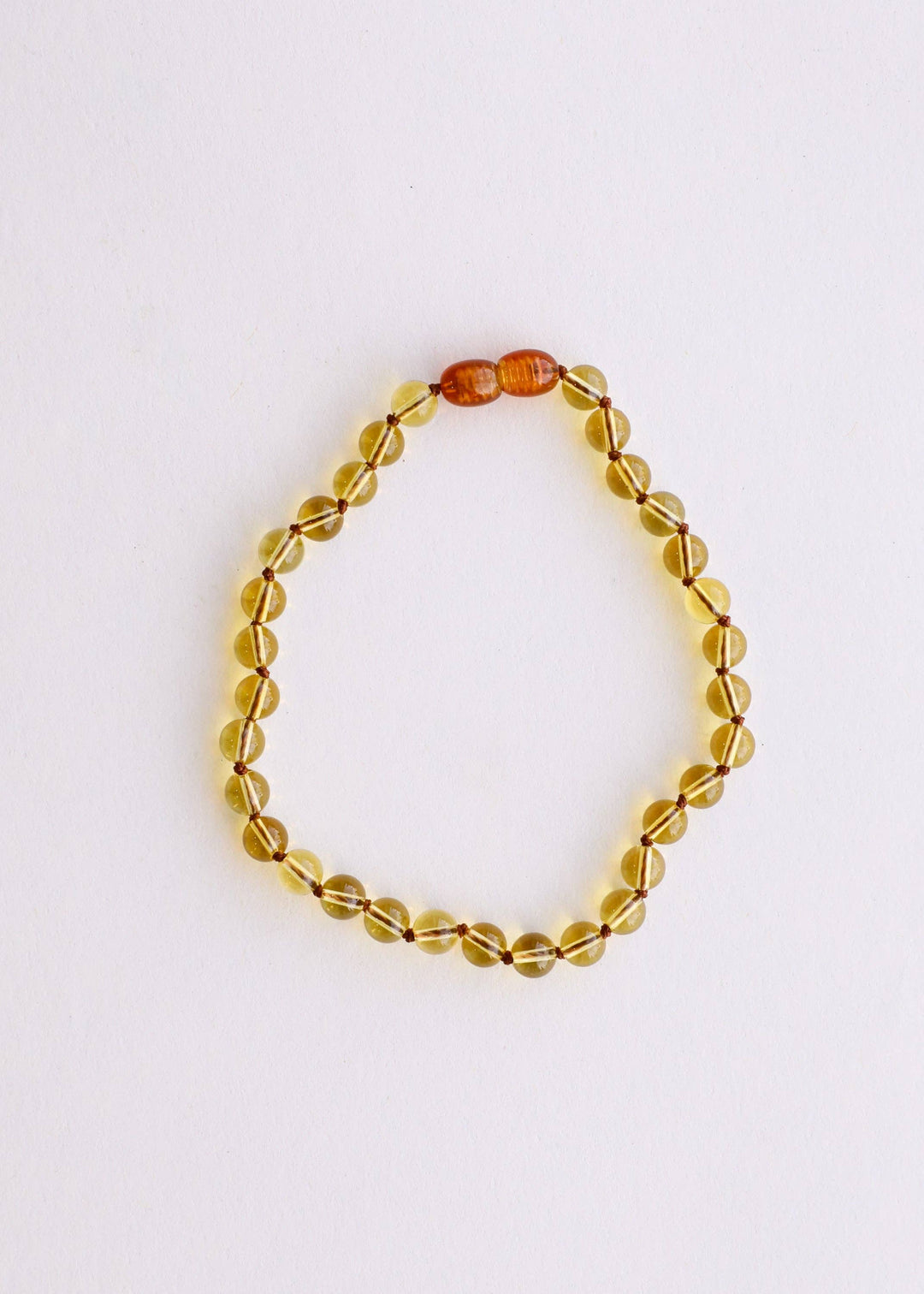 Citrine beaded necklace on a white background