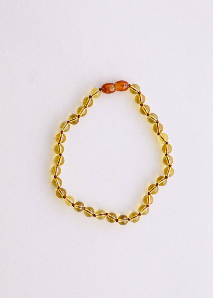 Citrine beaded necklace on a white background