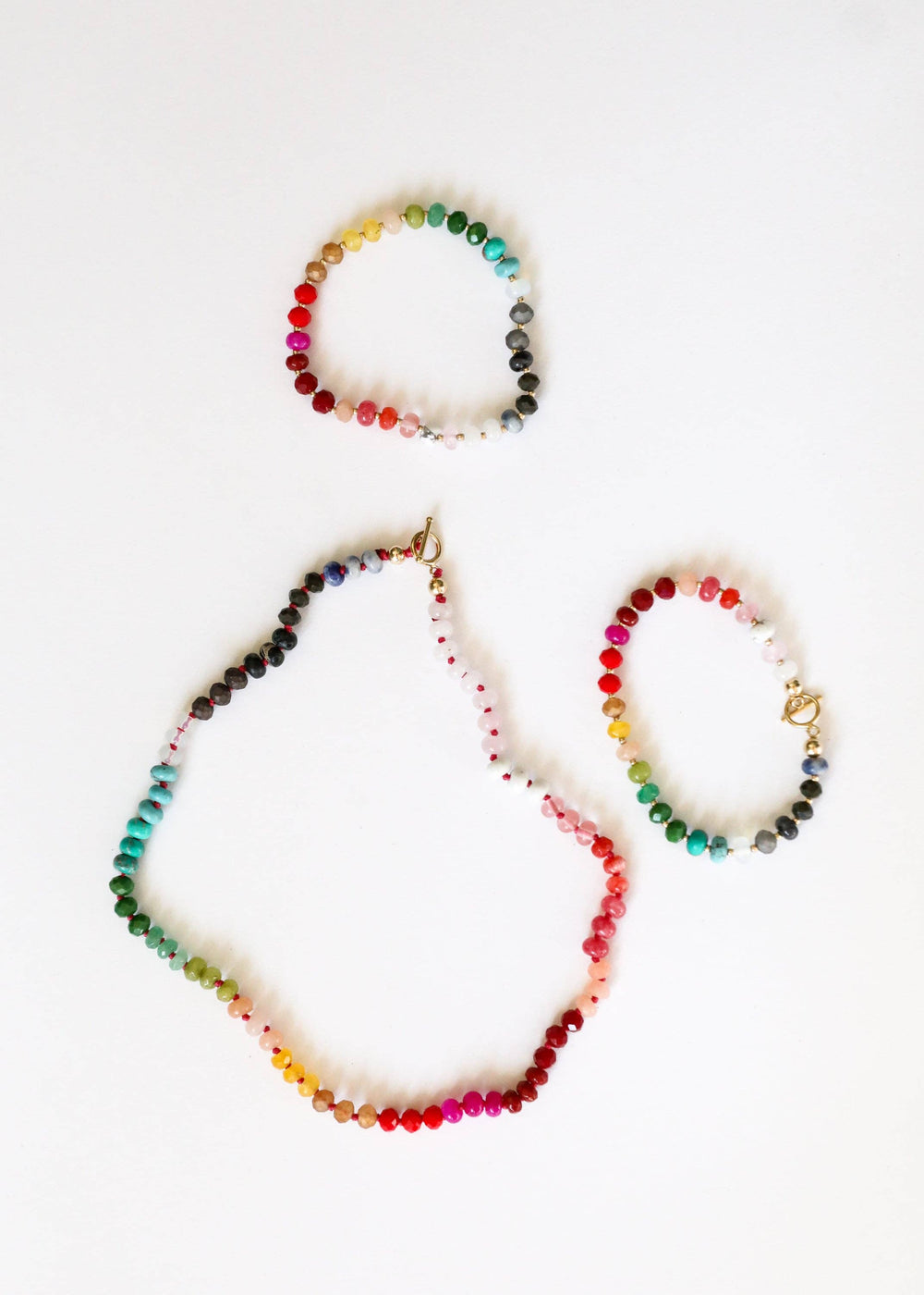 Paradise gemstone necklace shown with matching bracelets