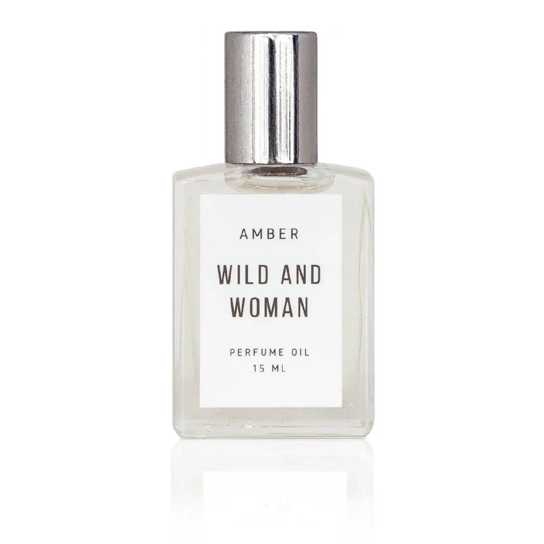 Amber perfume oil in a clear glass rollerball bottle