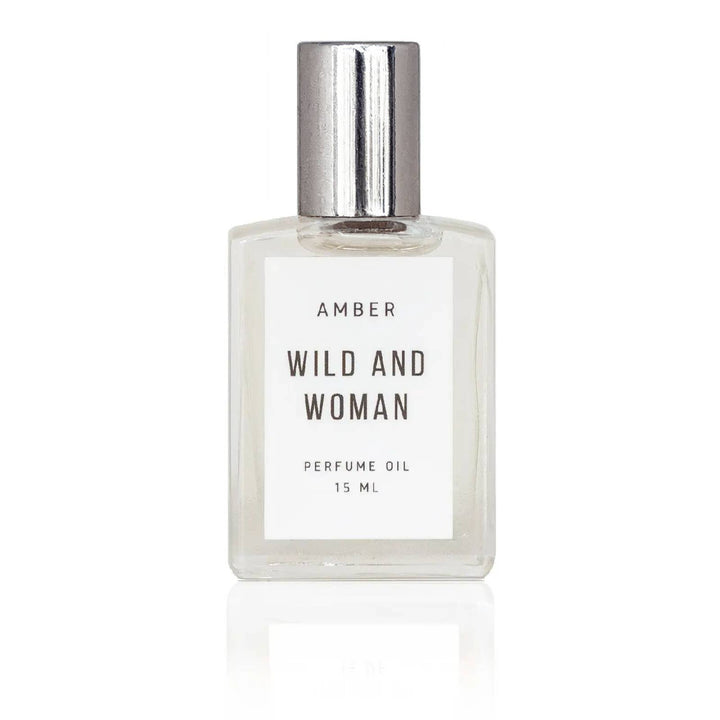 Amber perfume oil in a clear glass rollerball bottle