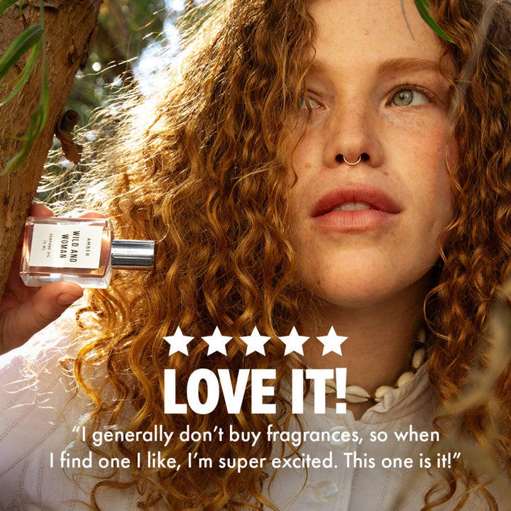 Woman holding Amber perfume oil beside a five star customer review