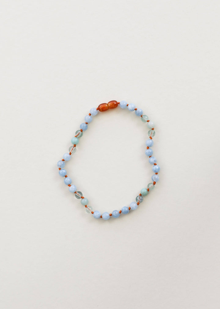 Aquamarine, fluorite and amazonite gemstone necklace laid flat
