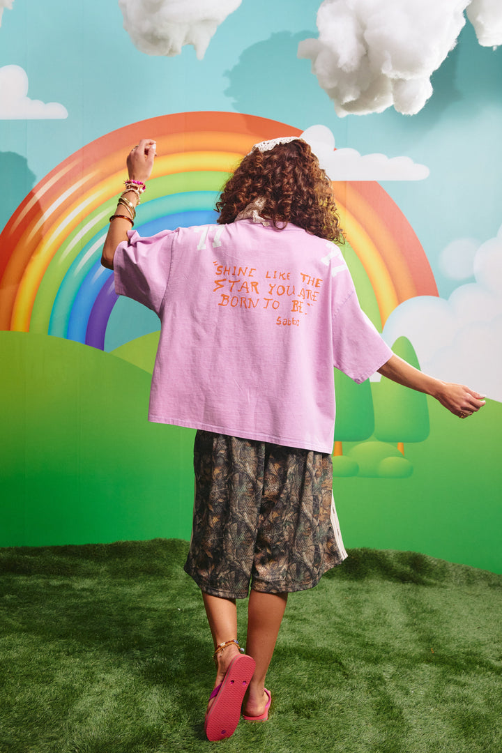 Back view of the purple 77 tee showing the Shine Like The Star You Are Born To Be graphic