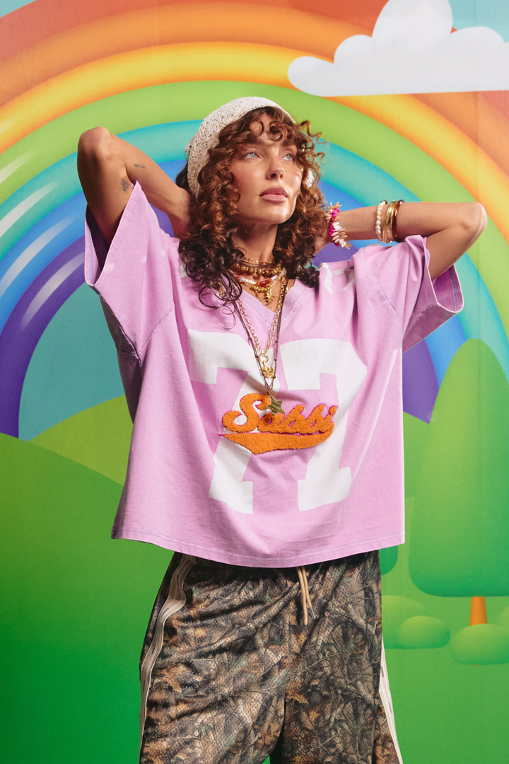 Sabbi 77 Tee in purple, front view with oversized 77 graphic
