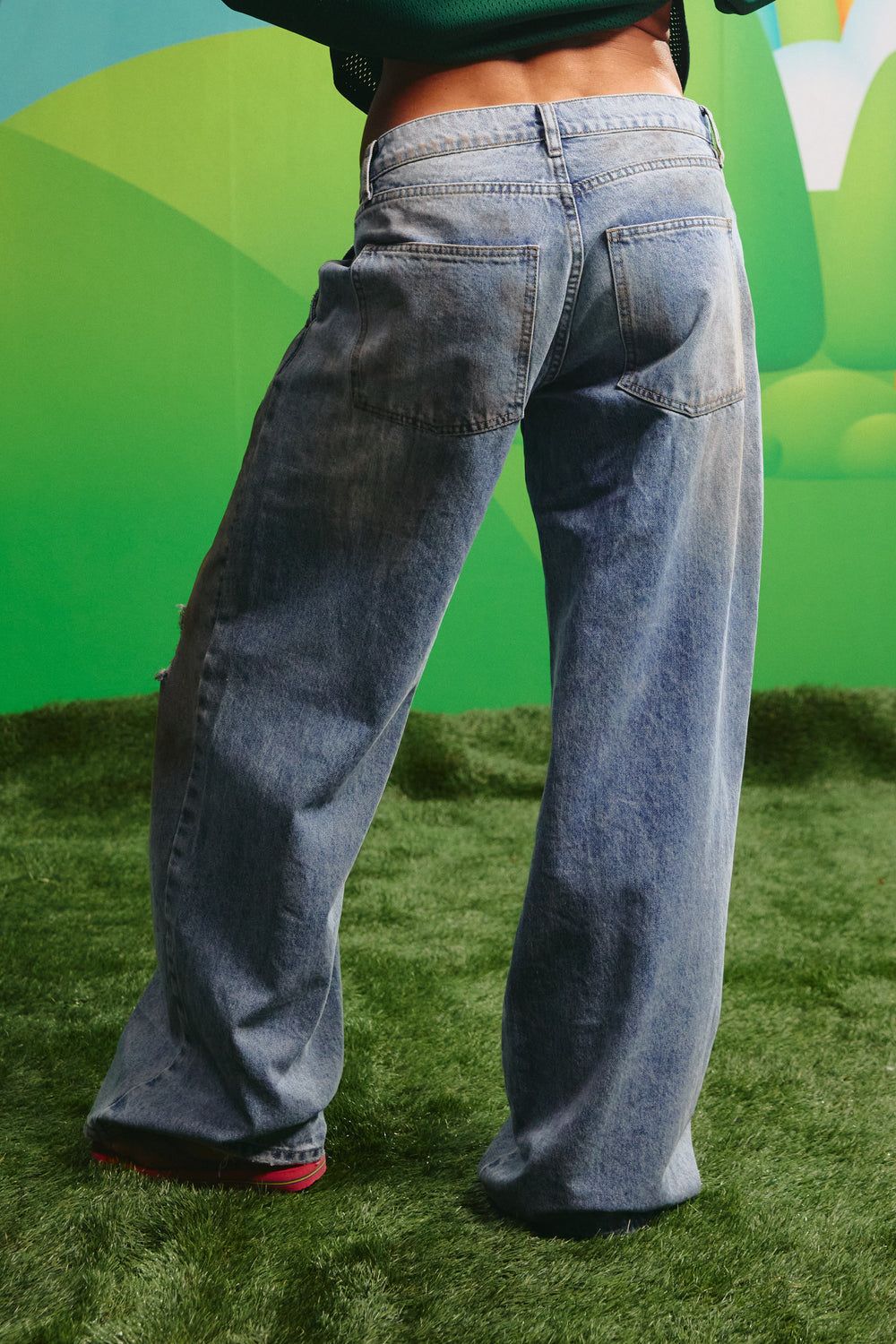 Back view of the Dirty Denim Jeans showing the wide leg fit