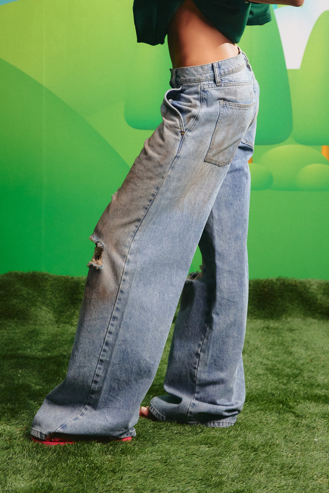 Side view of the Dirty Denim Jeans showing the relaxed silhouette