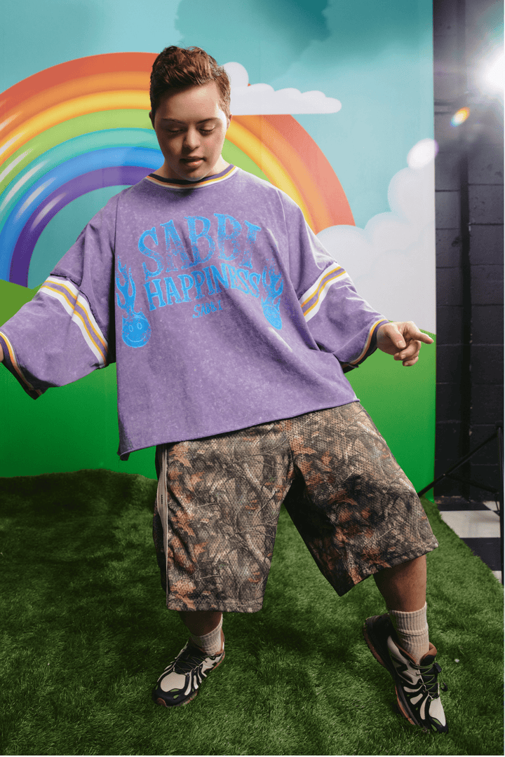 Model wearing the Sabbi Glad Rag tee in purple