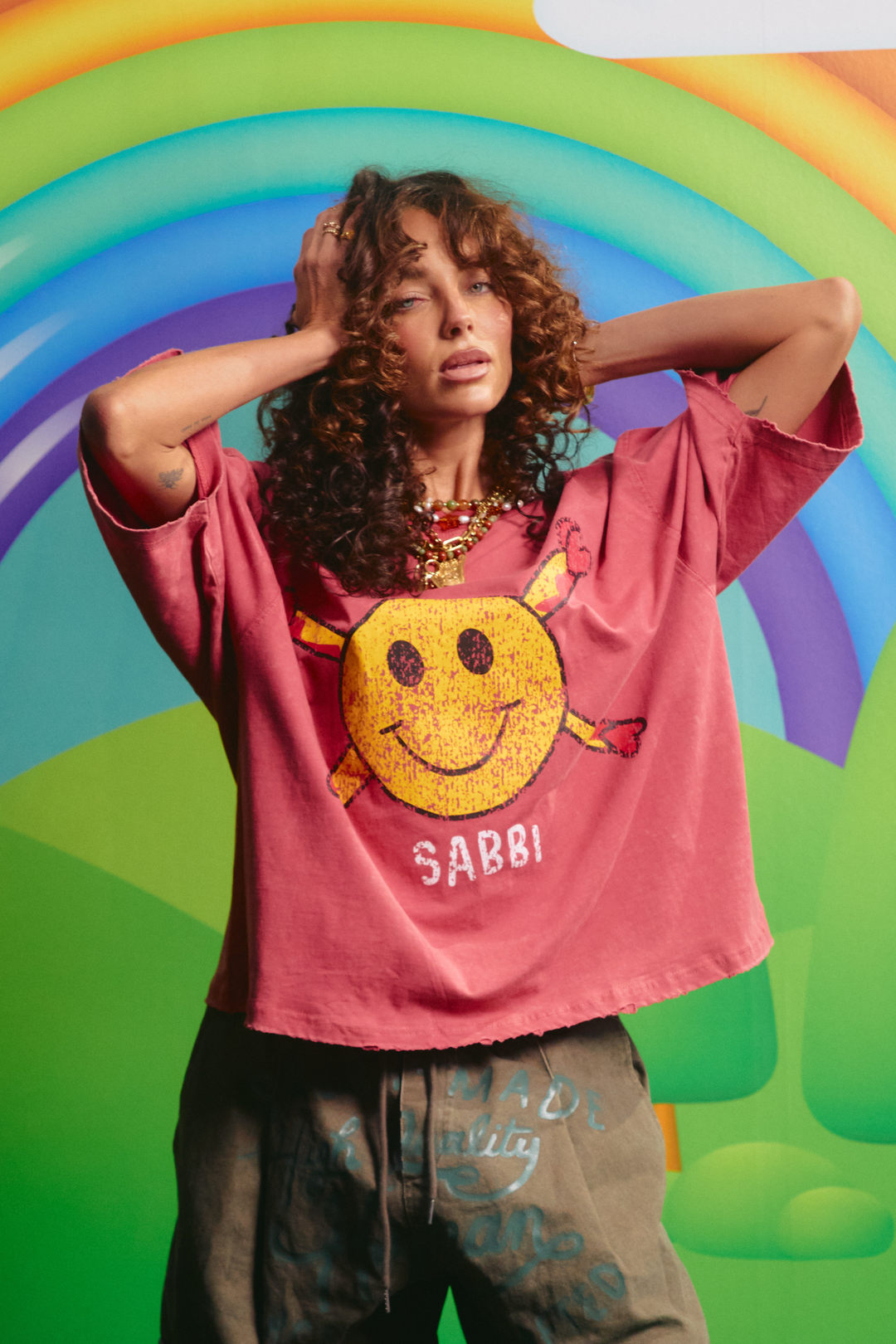 Sabbi Guy Smiley tee in red, front view with distressed smiley graphic