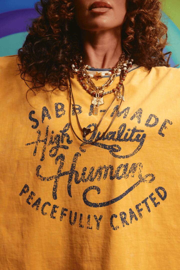 Close-up detail of the distressed graphic on the Happy Hour tee