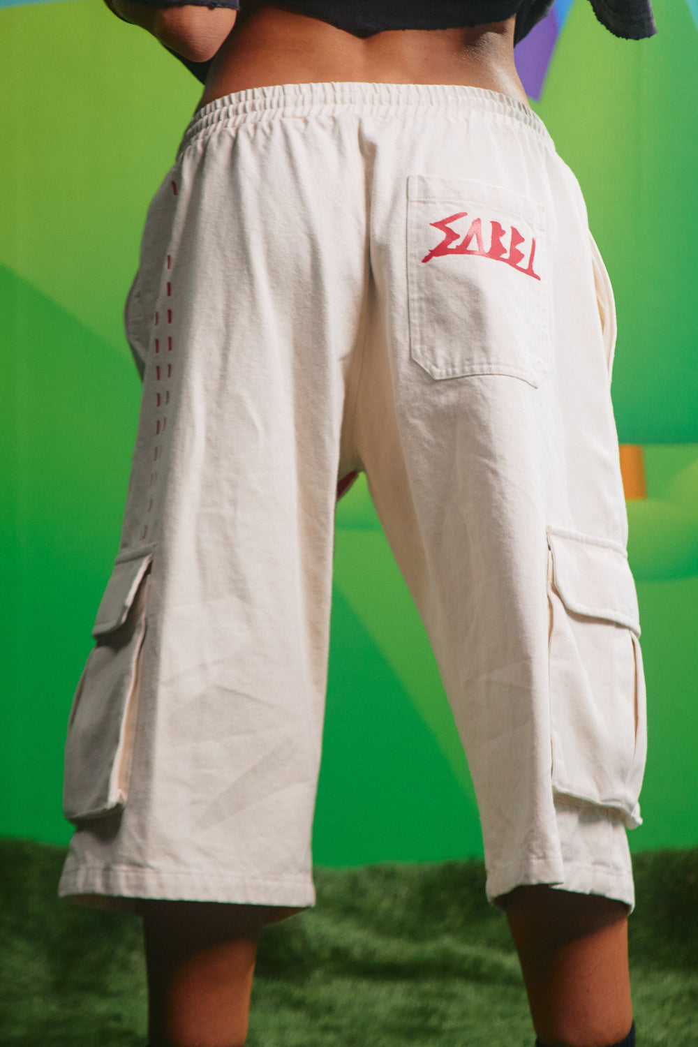 Back view of the cream High Quality Human Jorts showing the back patch pocket