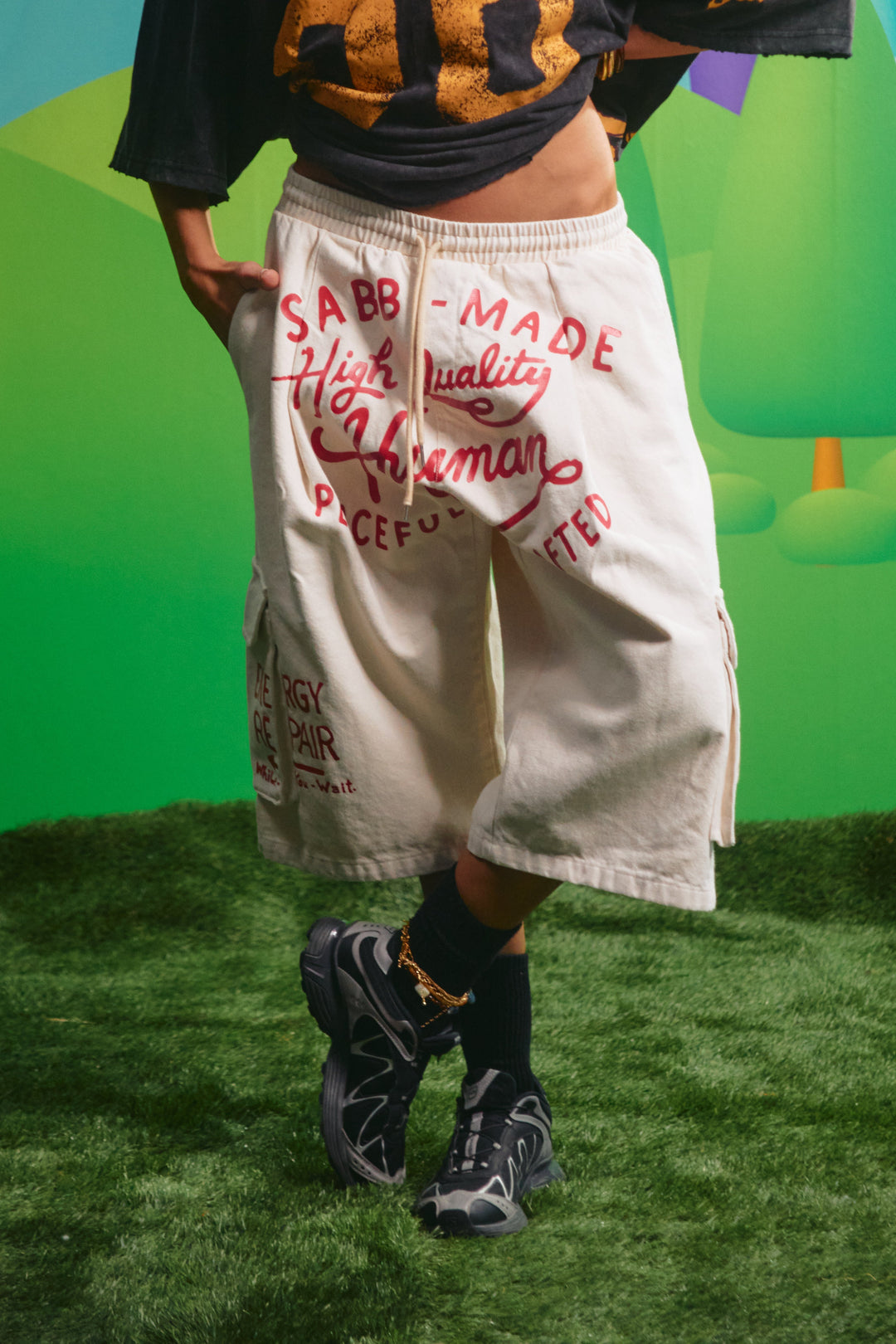 Sabbi High Quality Human Jorts in cream, front view with graphic and cargo pockets