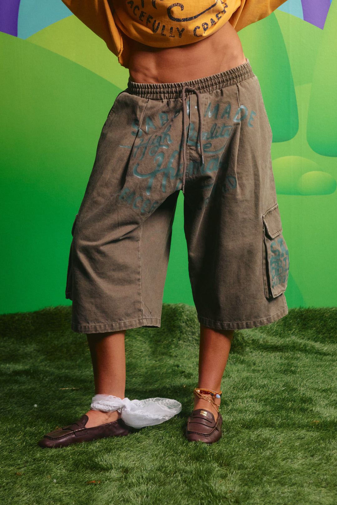 Sabbi High Quality Human Jorts in khaki, front view with graphic and cargo pockets
