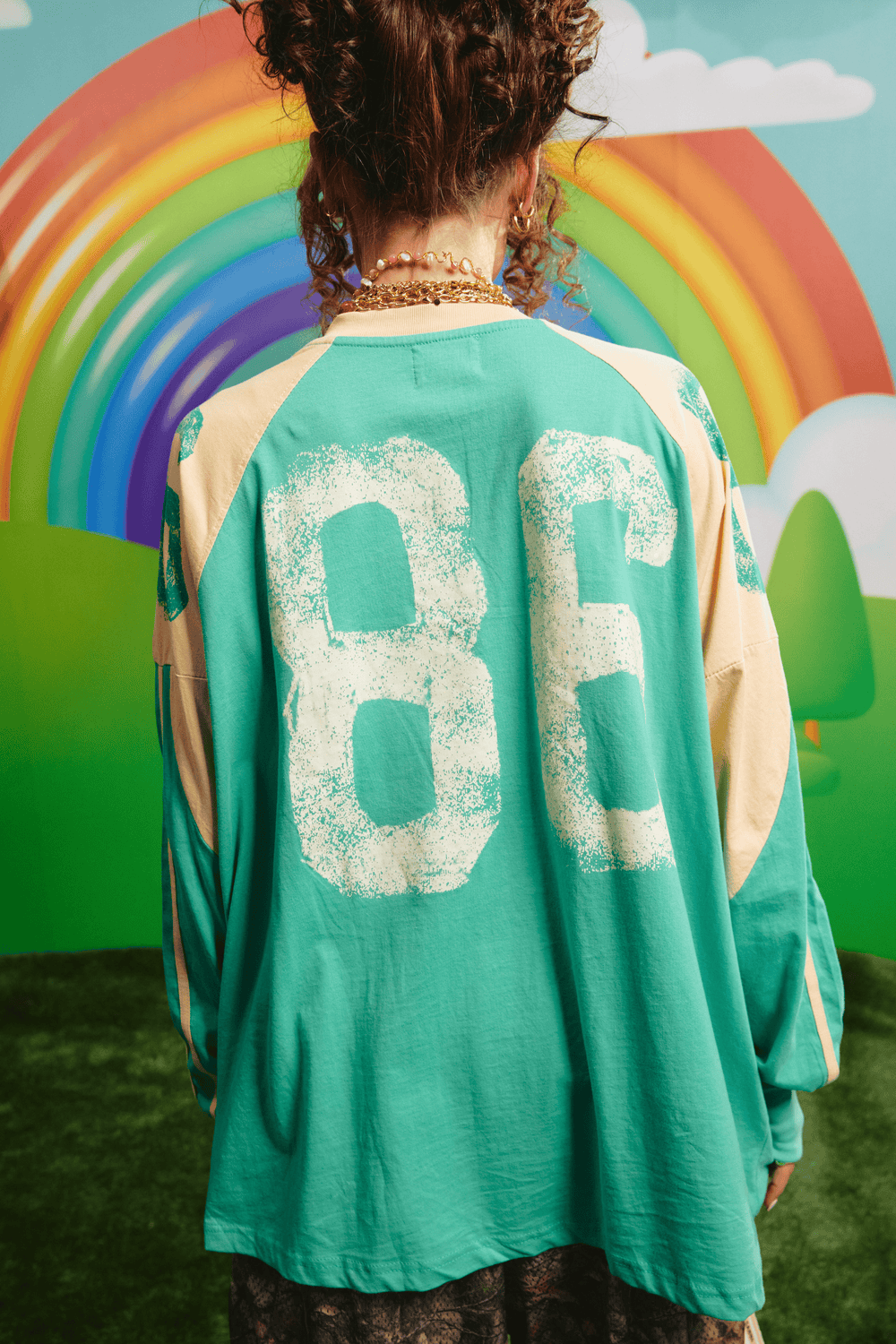 Back view of the green High Quality Human Long Sleeve Tee showing the 86 graphic