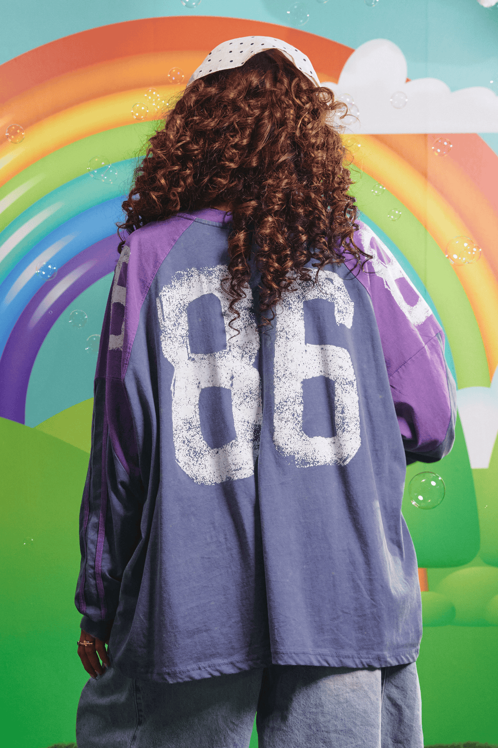 Back view of the purple High Quality Human Long Sleeve Tee showing the 86 graphic