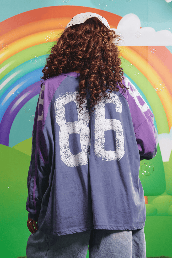 Back view of the purple High Quality Human Long Sleeve Tee showing the 86 graphic