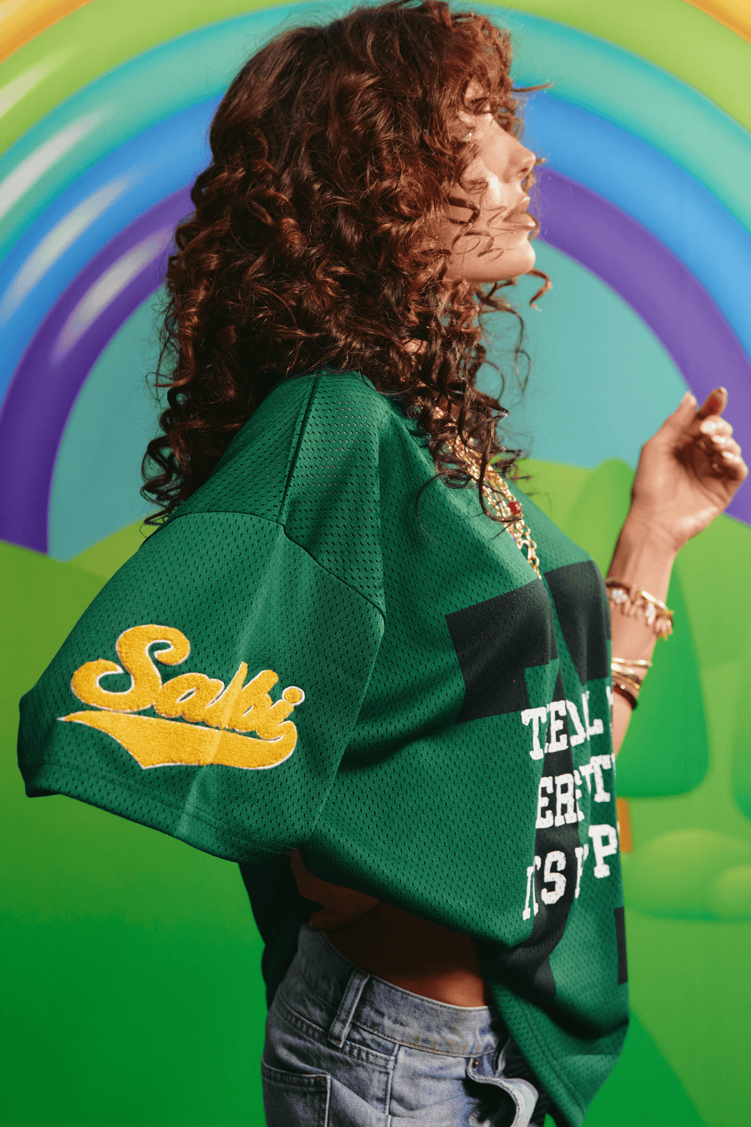 Side view of the oversized green Sabbi mesh tee