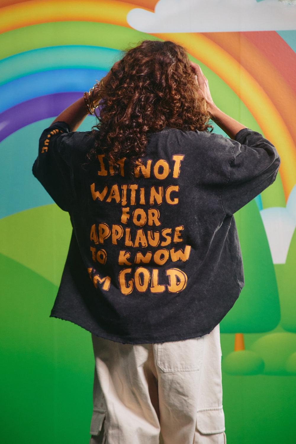 Back view of the You're Gold tee showing the statement graphic