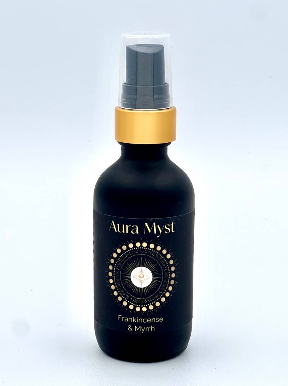 Black bottle with gold cap labeled 'Aura Myst' on a light gray background