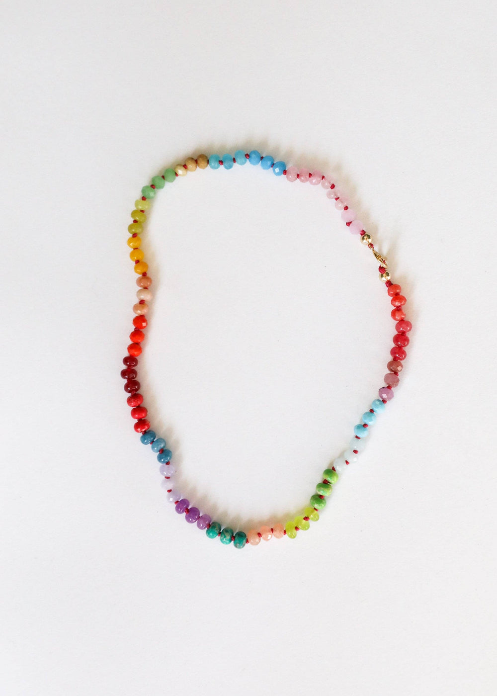 Skyline rainbow gemstone necklace with gold filled toggle laid flat