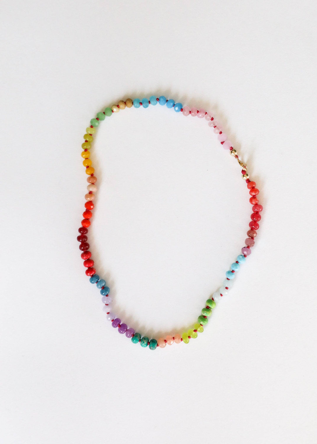 Skyline rainbow gemstone necklace with gold filled toggle laid flat