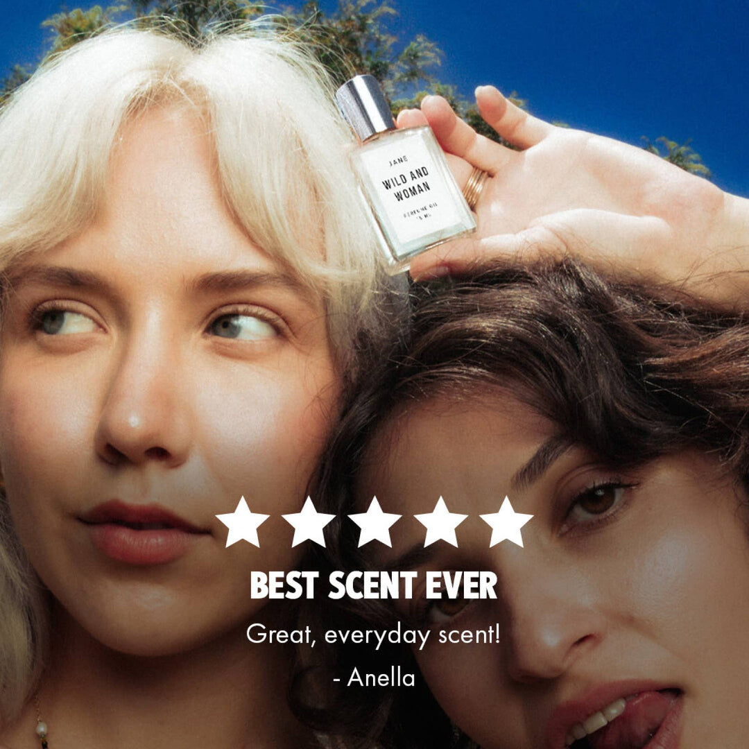 Woman holding Jane perfume oil beside a five star customer review