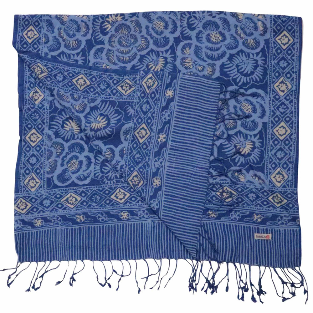 Blue patterned scarf with white tassels on a white background