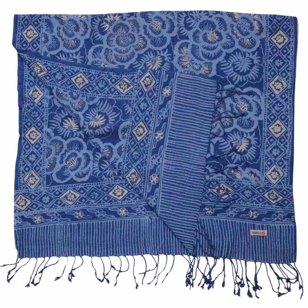 Blue patterned scarf with white tassels on a white background