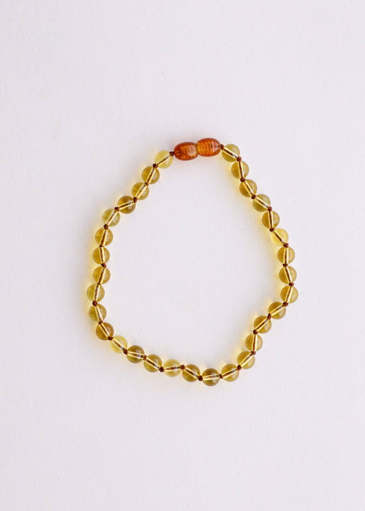 Citrine beaded necklace on a white background