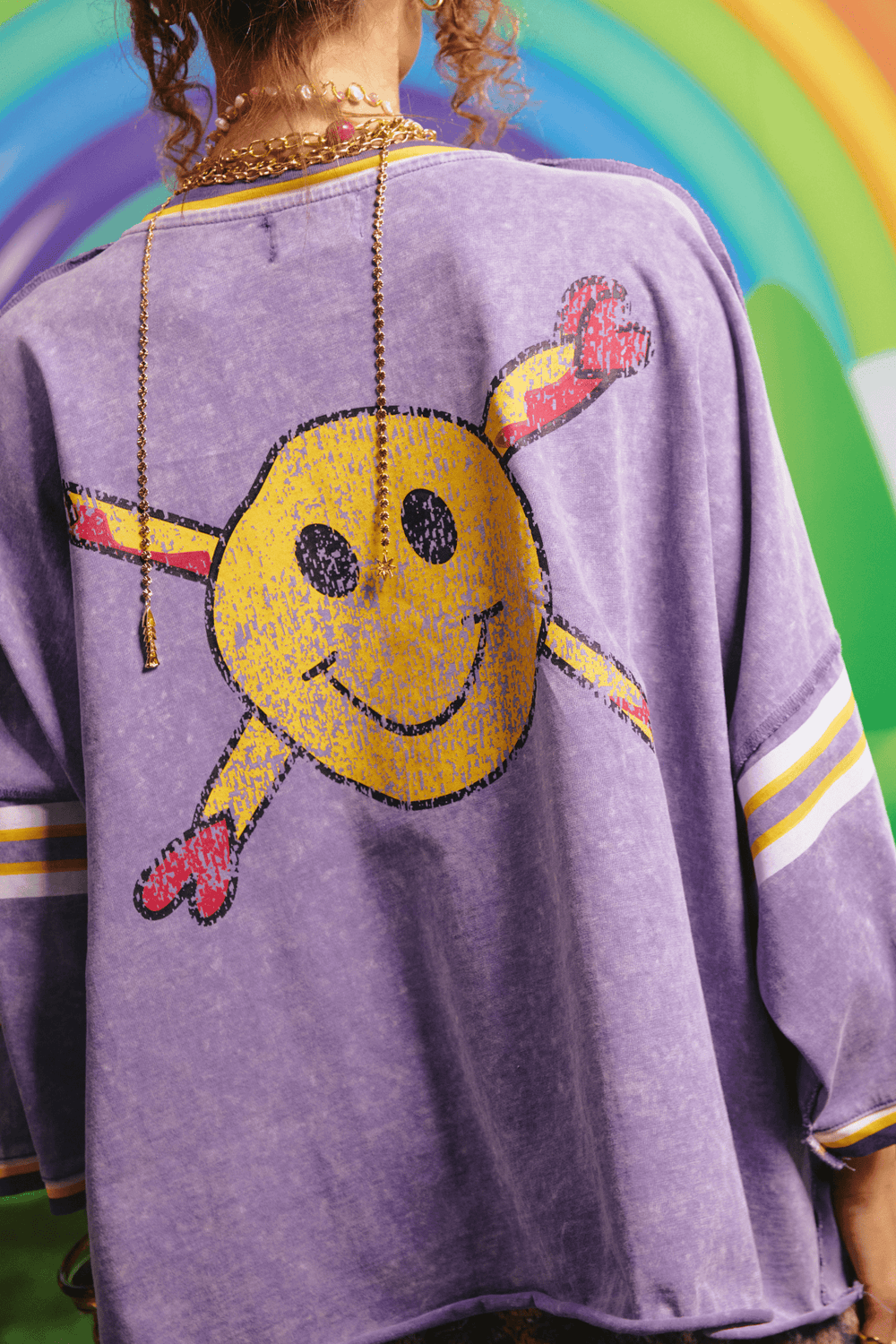 Back view of the Glad Rag tee showing the smiley character graphic