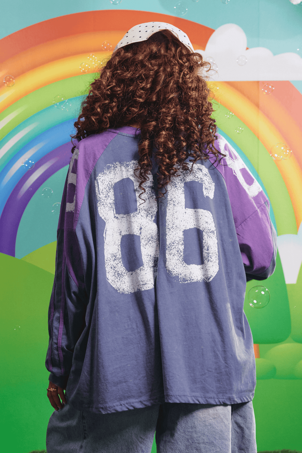 Back view of the purple High Quality Human Long Sleeve Tee showing the 86 graphic
