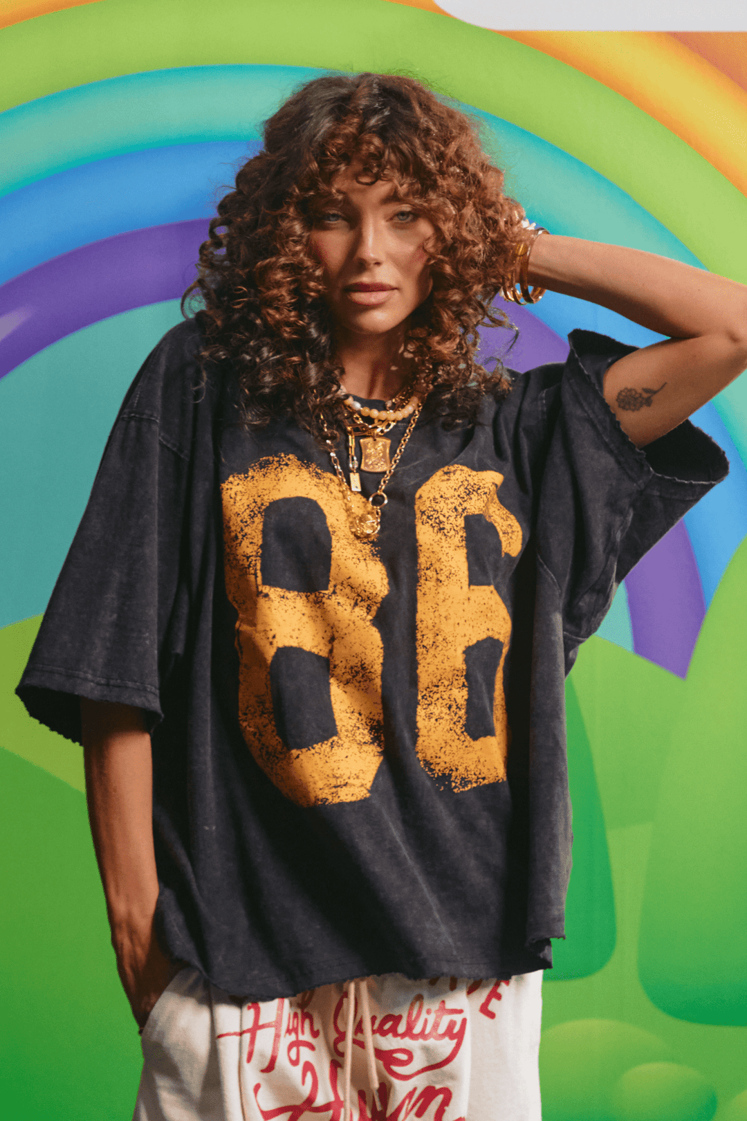 Sabbi You're Gold tee in black, front view with distressed 86 graphic