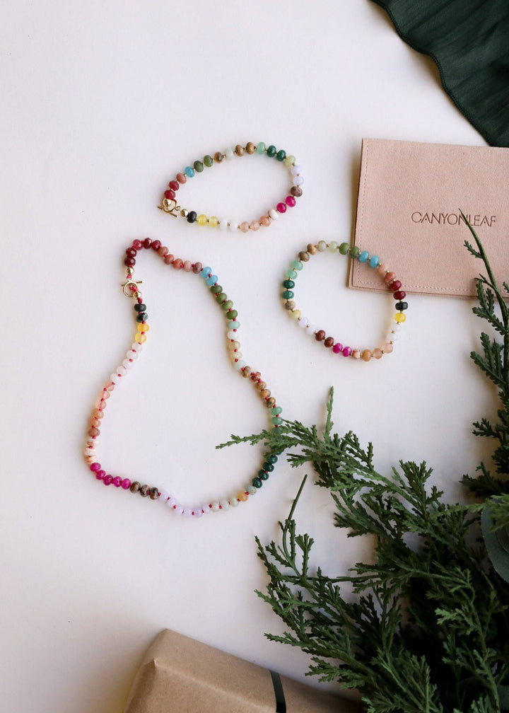 Sedona gemstone necklace and bracelets styled with greenery