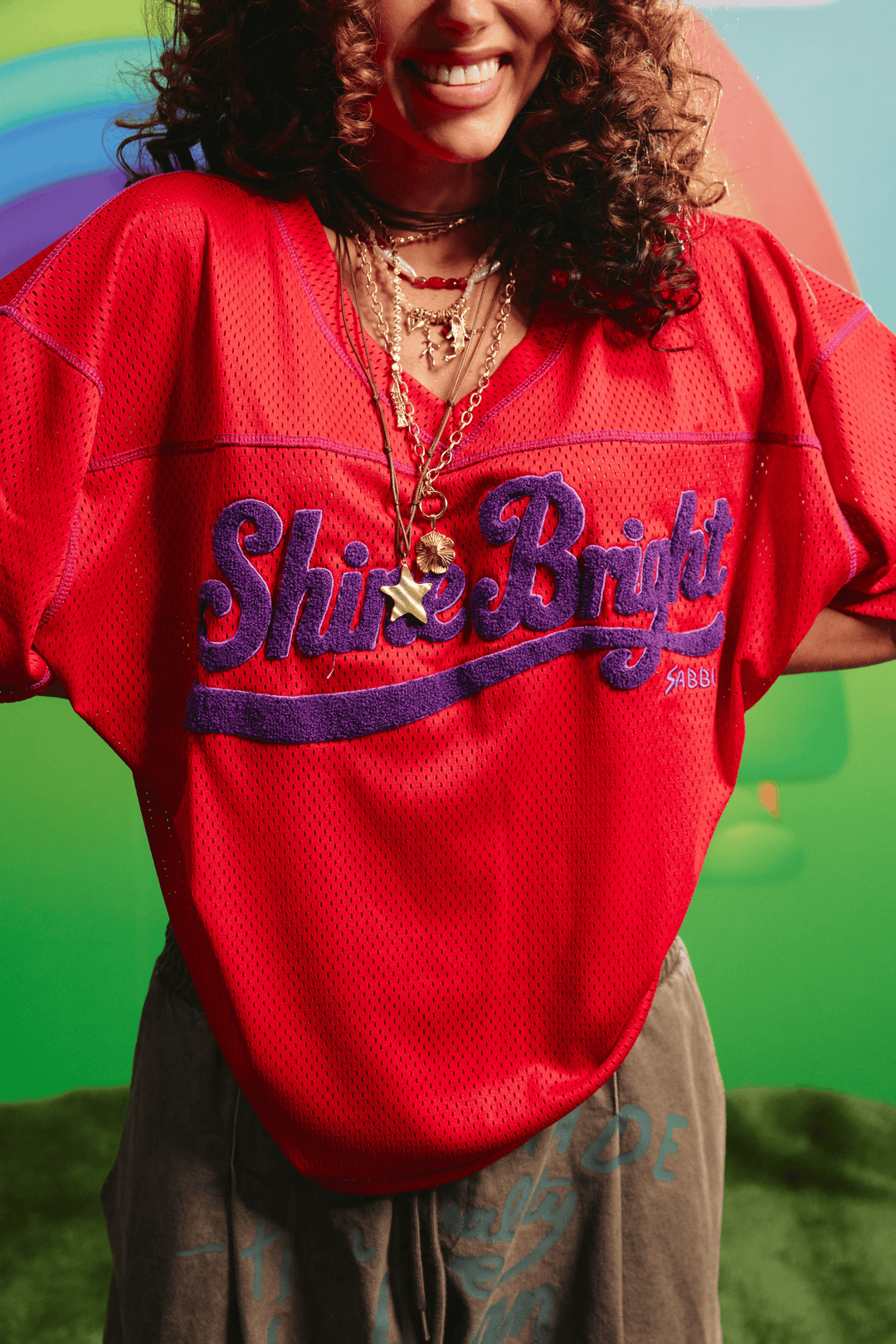 Close-up detail of the red mesh tee&