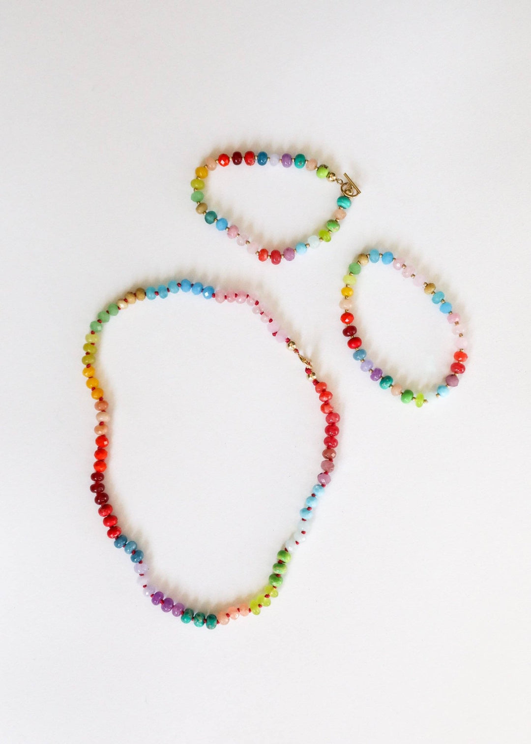 Skyline gemstone necklace shown with matching bracelets