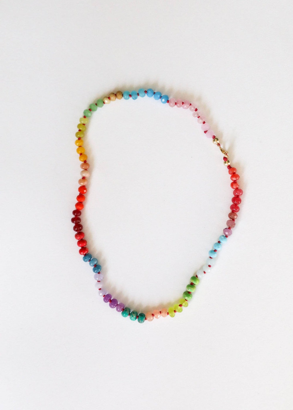 Skyline rainbow gemstone necklace with gold filled toggle laid flat