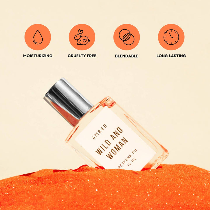 Amber perfume oil on orange sand with icons for moisturizing, cruelty free, blendable and long lasting