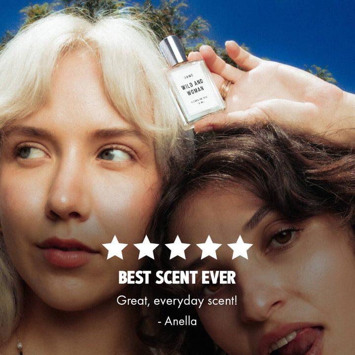 Woman holding Jane perfume oil beside a five star customer review